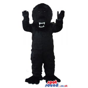 Fierceful black gorilla with sharp teeth - Custom Mascots