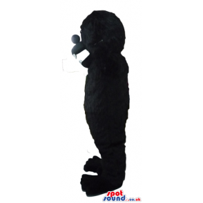 Fierceful black gorilla with sharp teeth - Custom Mascots