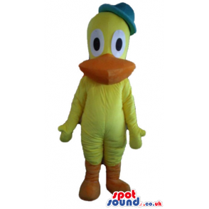 Yellow duck with orange beak and legs, big ears wearing a blue