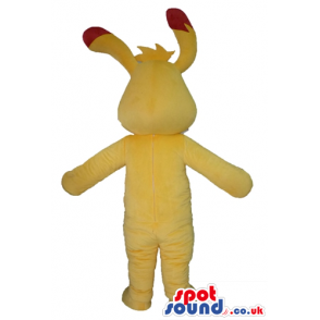 Yellow monster with red details on ears, belly and forehead -