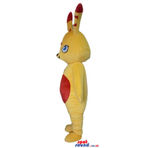 Yellow monster with red details on ears, belly and forehead -