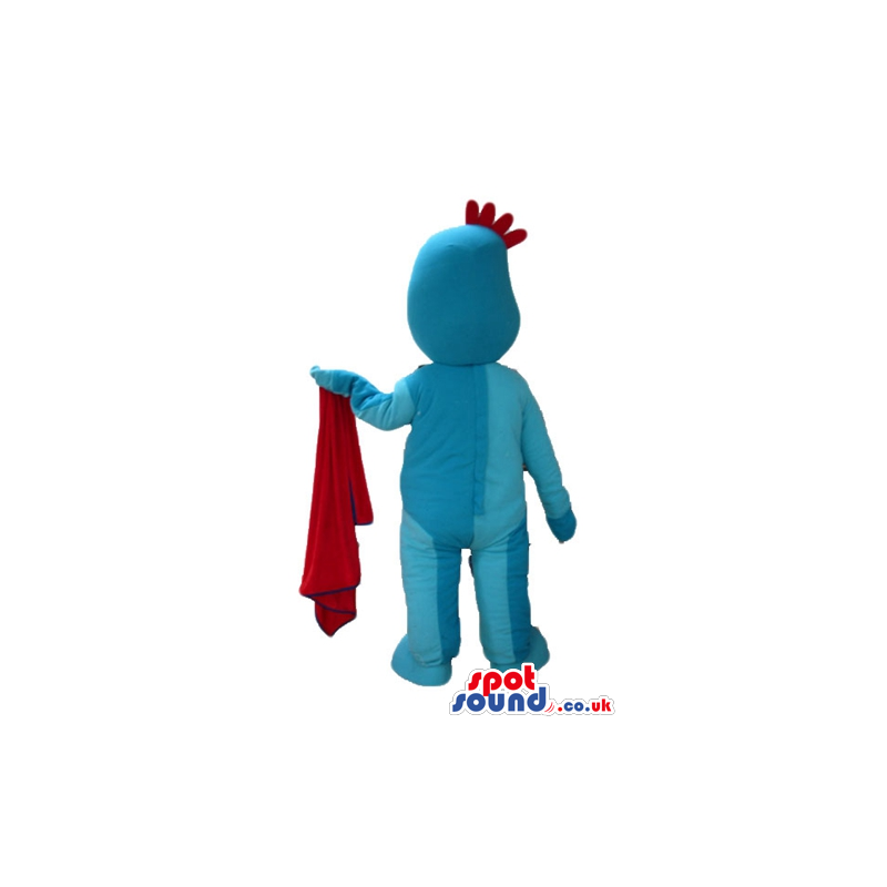 Light blue man with small eyes and short red hair holding a red