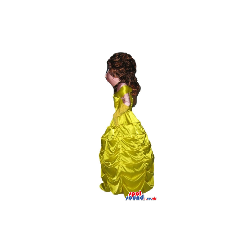 Princess with long brown hair wearing a long yellow dress -