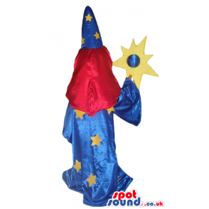 Witch with long red hair wearing a blue tunic with yellow stars