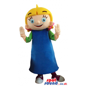 Blonde girl with big eyes wearing a green t-shirt, a blue dress