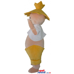 Fat smiling boy showing its belly wearing a yellow hat and