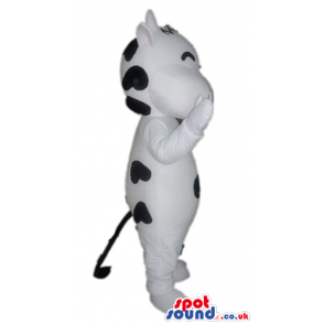 Happy white cow with a few black dots - Custom Mascots